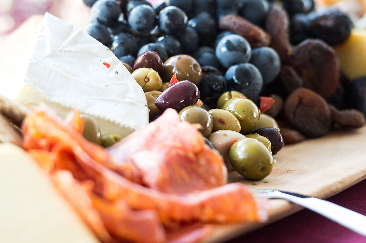 Ottawa event photos showing closeup details of a charcuterie board being served to guests at a corporate anniversary event.  Captured by JEMMAN Photography COMMERCIAL