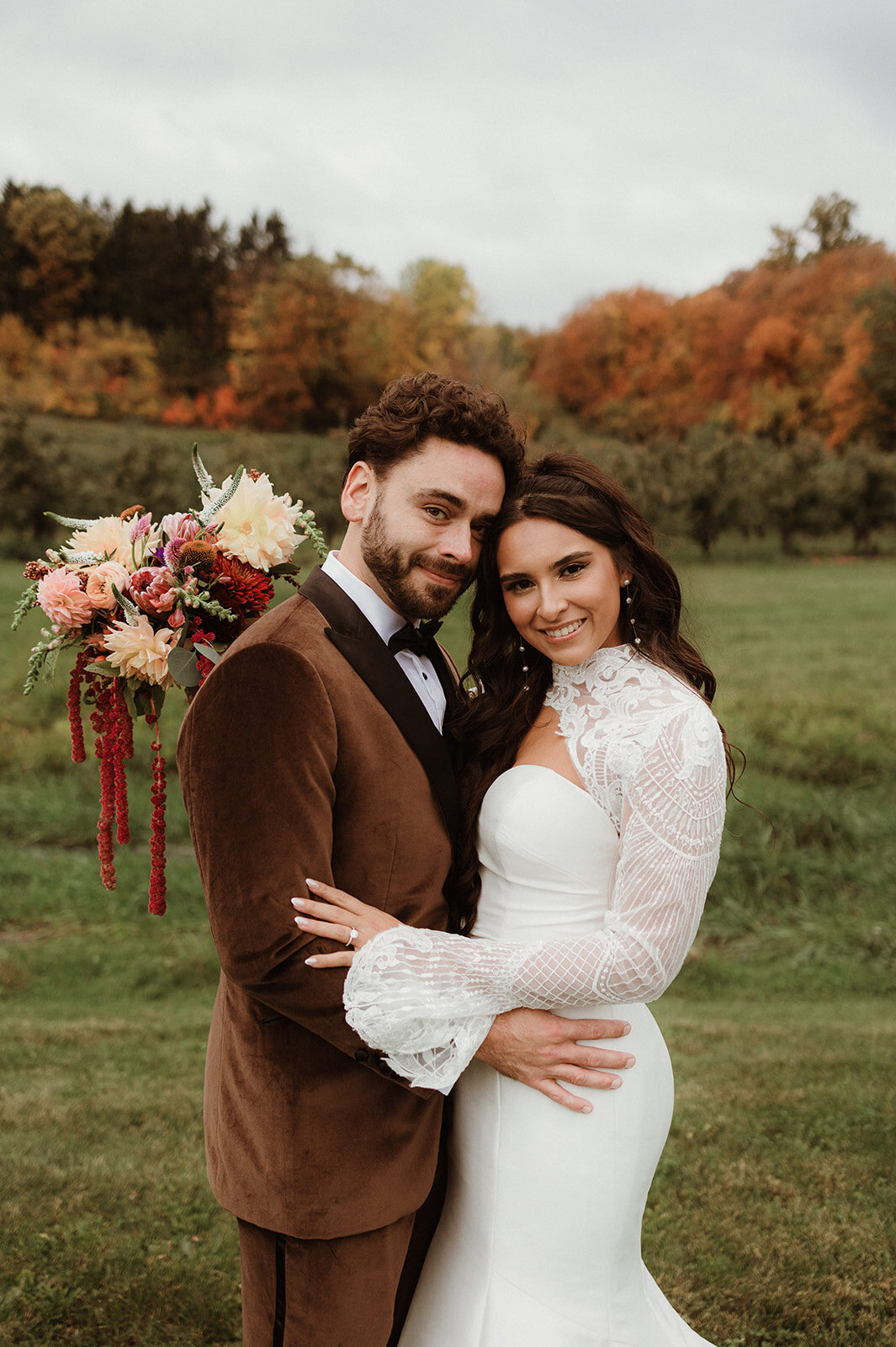 Romantic wedding portraits at a Hudson Valley winery featuring scenic fall views

