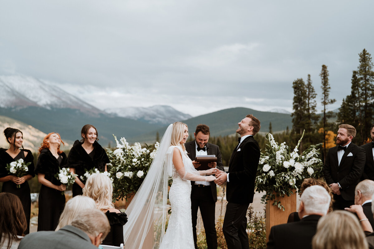Mountain ceremony in Breckenridge with joyful vows, captured by local elopement photo and video team.