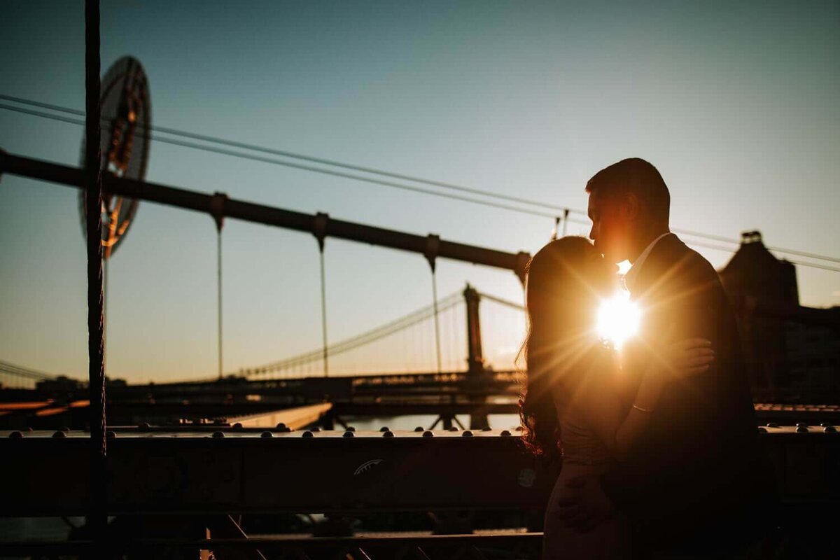 Couple being lit up by the setting sun in Brooklyn New York.