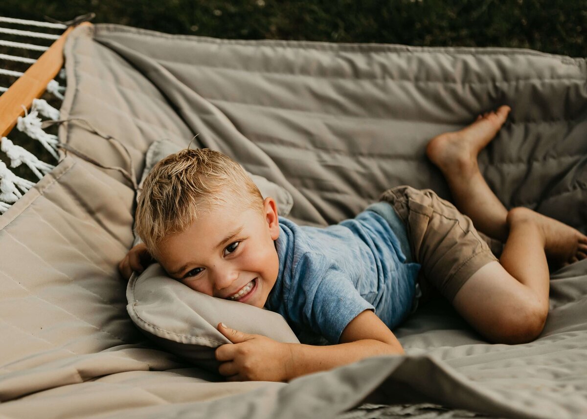 A young boy relaxing in a hammock, captured by a Pittsburgh family photographer.