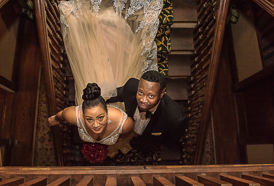 Couple on staircase looking up