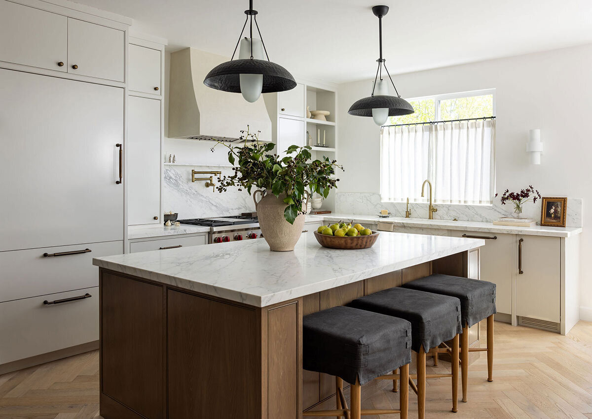 Clean-lined kitchen with marble backsplash and functional interior design
