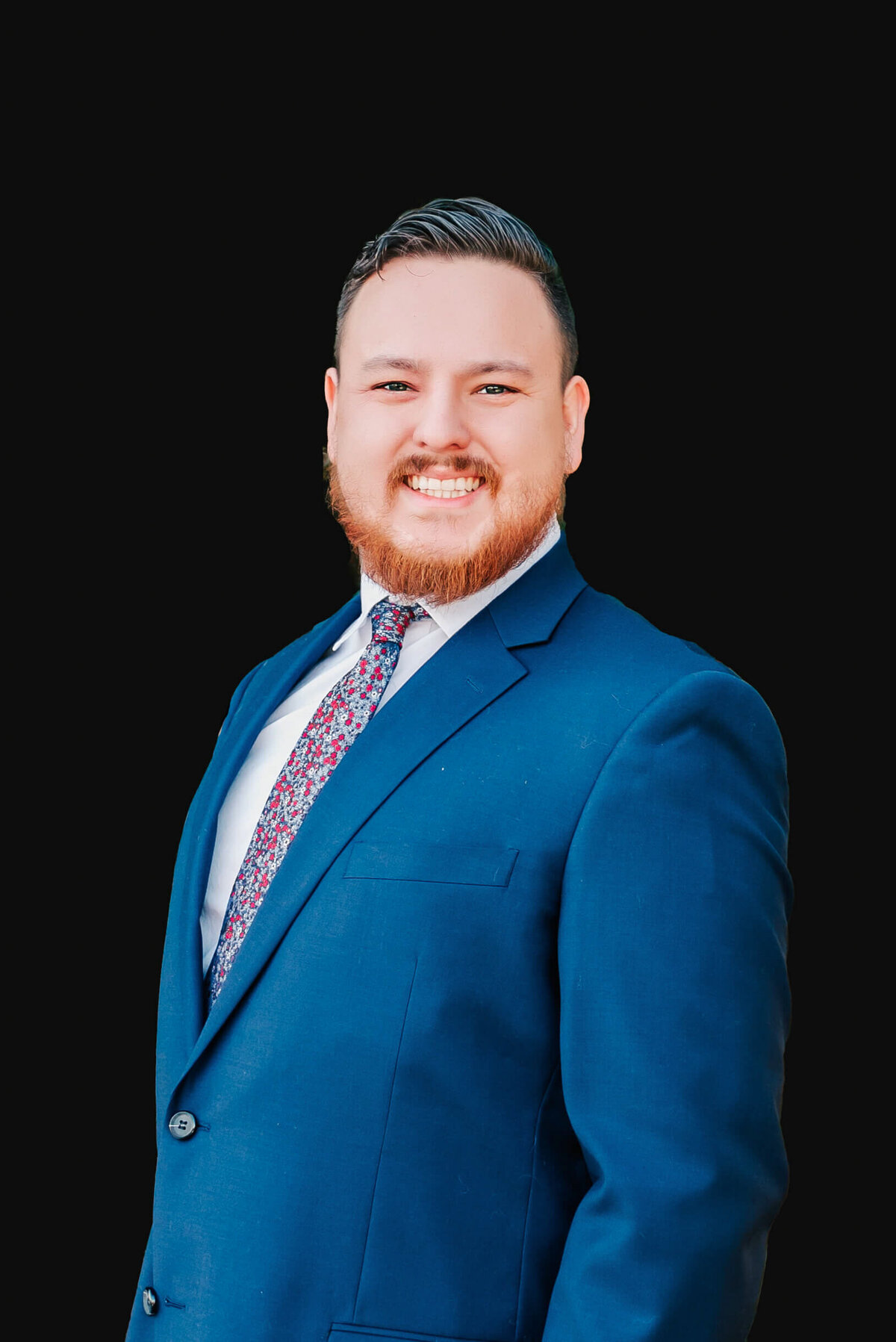 professional headshot pictures in Springfield MO` of hea man smiling in blue suit