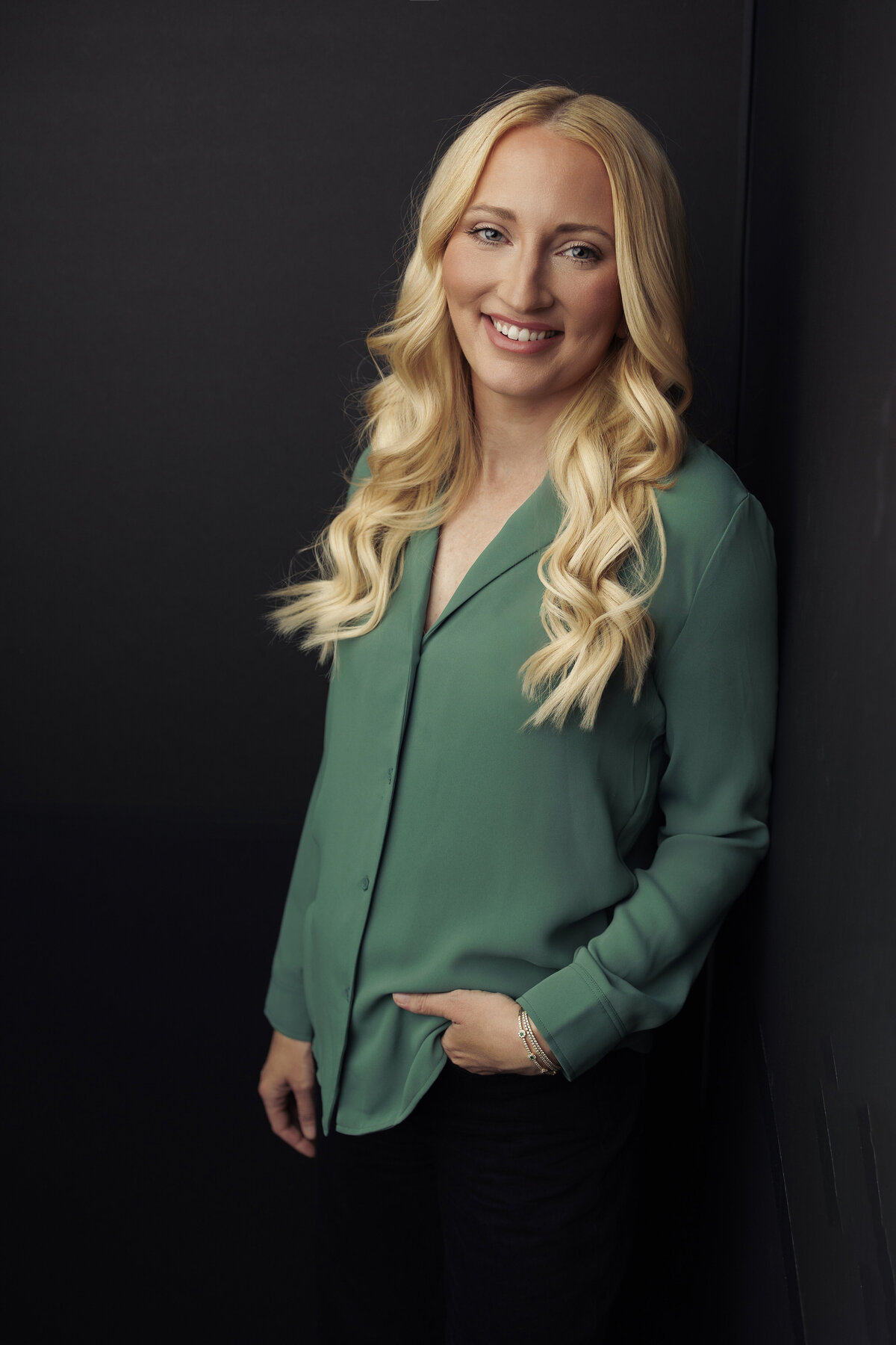 Personal branding portrait for a female executive in a contemporary studio setting by Haili Barton Photography.