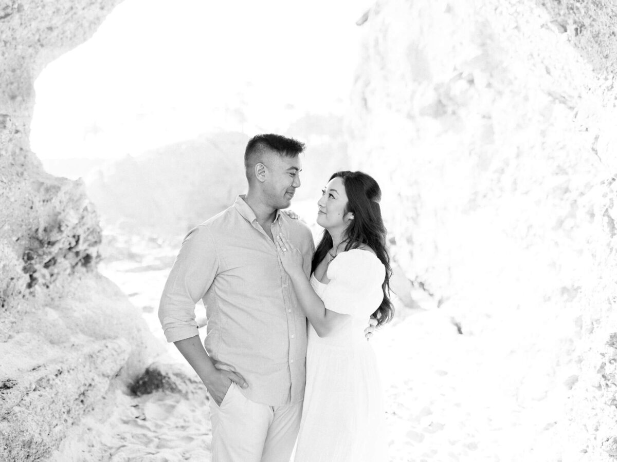 black and white laguna beach couple engagement photo