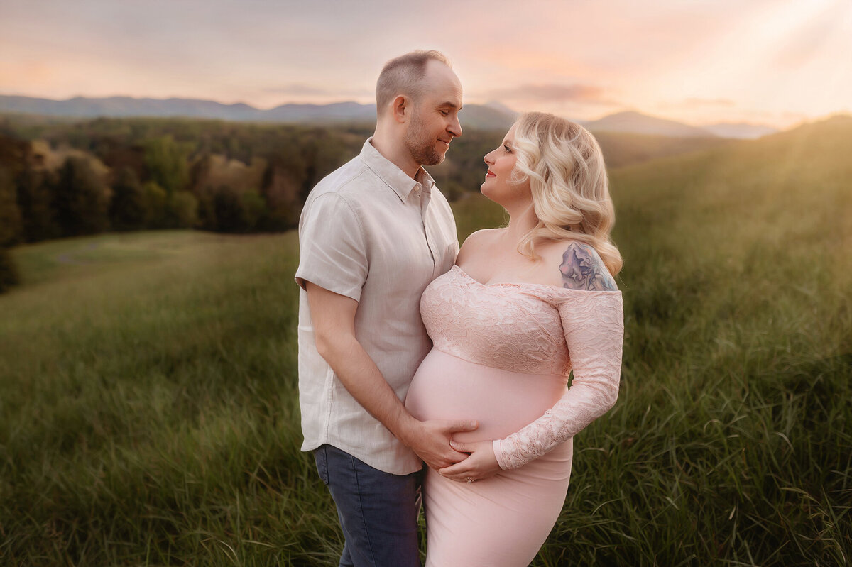 Expectant parents pose for Maternity Photoshoot at Biltmore Estate in Asheville, NC.