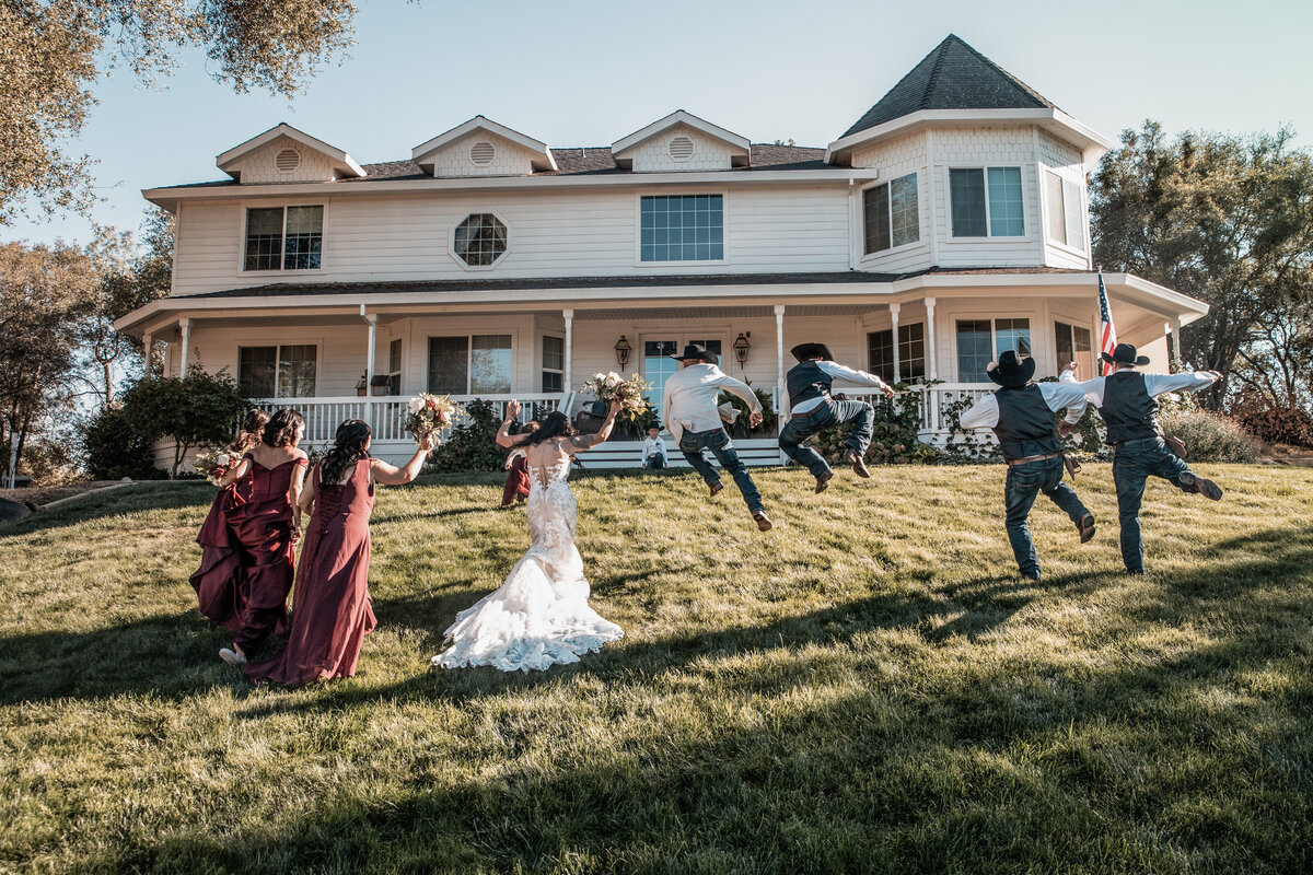 bridal party jumping in air