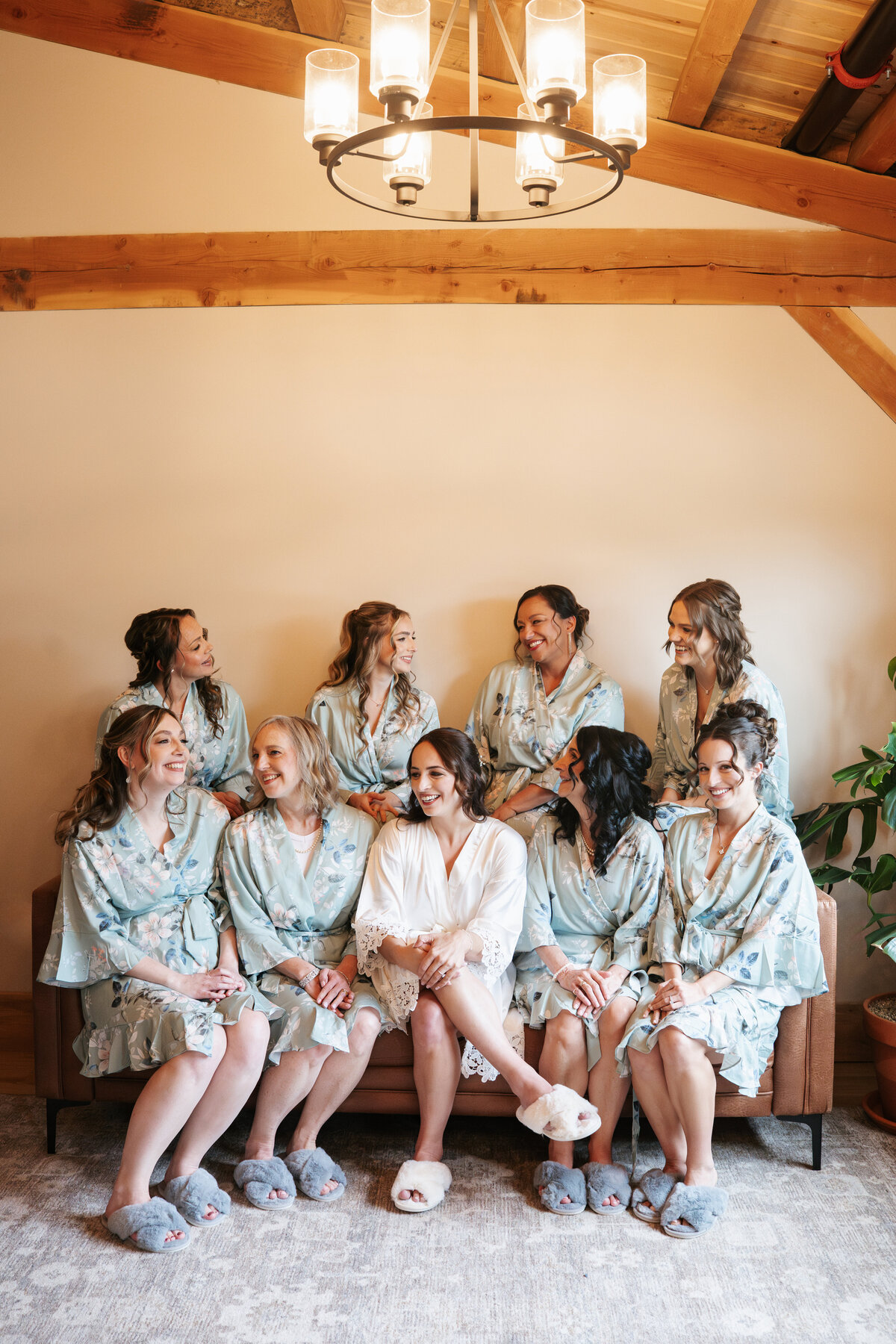 Bride getting ready with her bridesmaids on the morning of her wedding