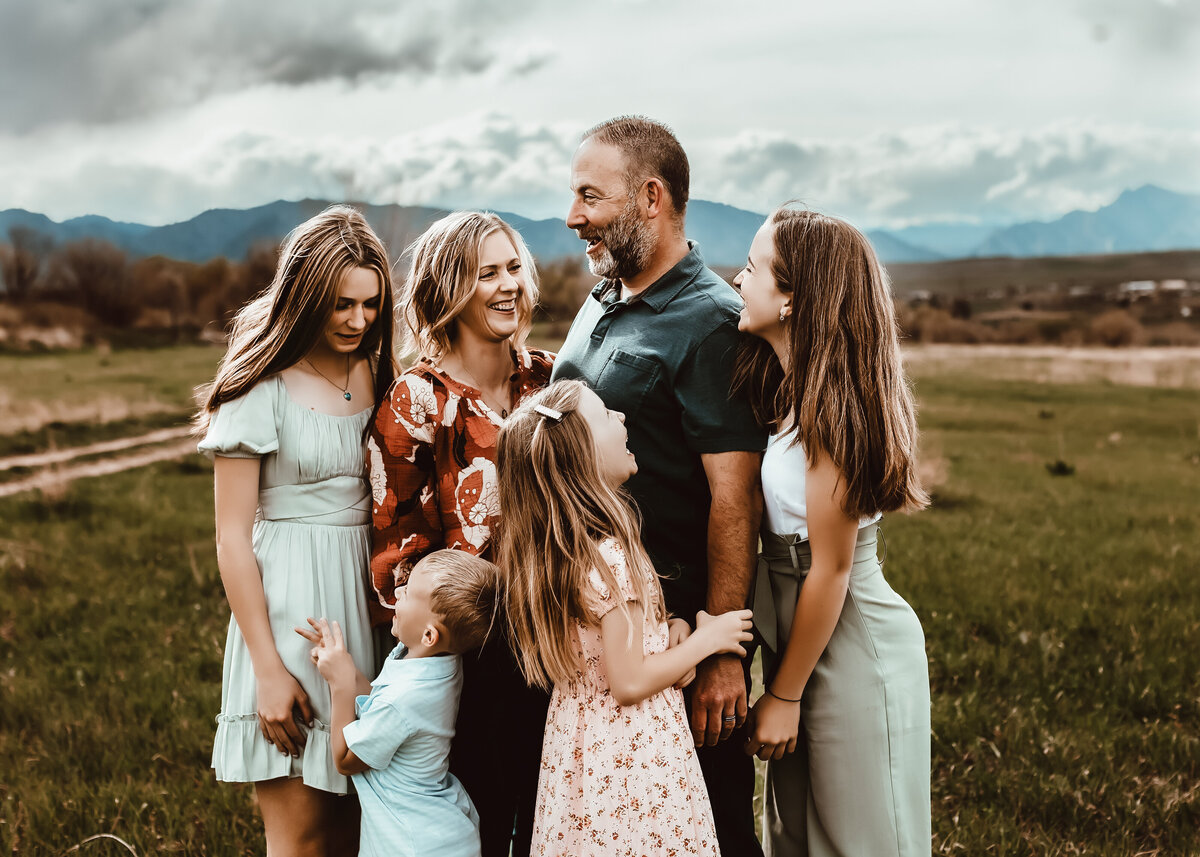 Candid family picture  at sunset in a field in Westminster Colorado