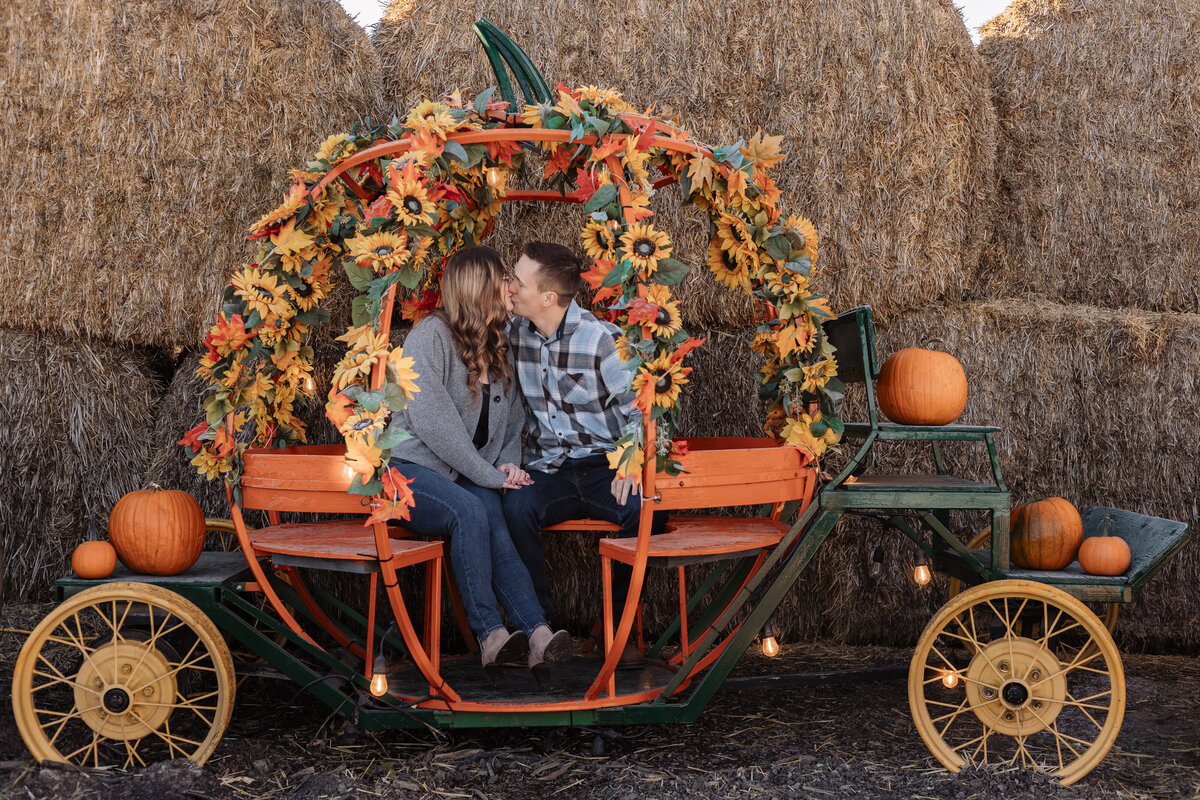 engaged-couple-in-pumpkin-carriage