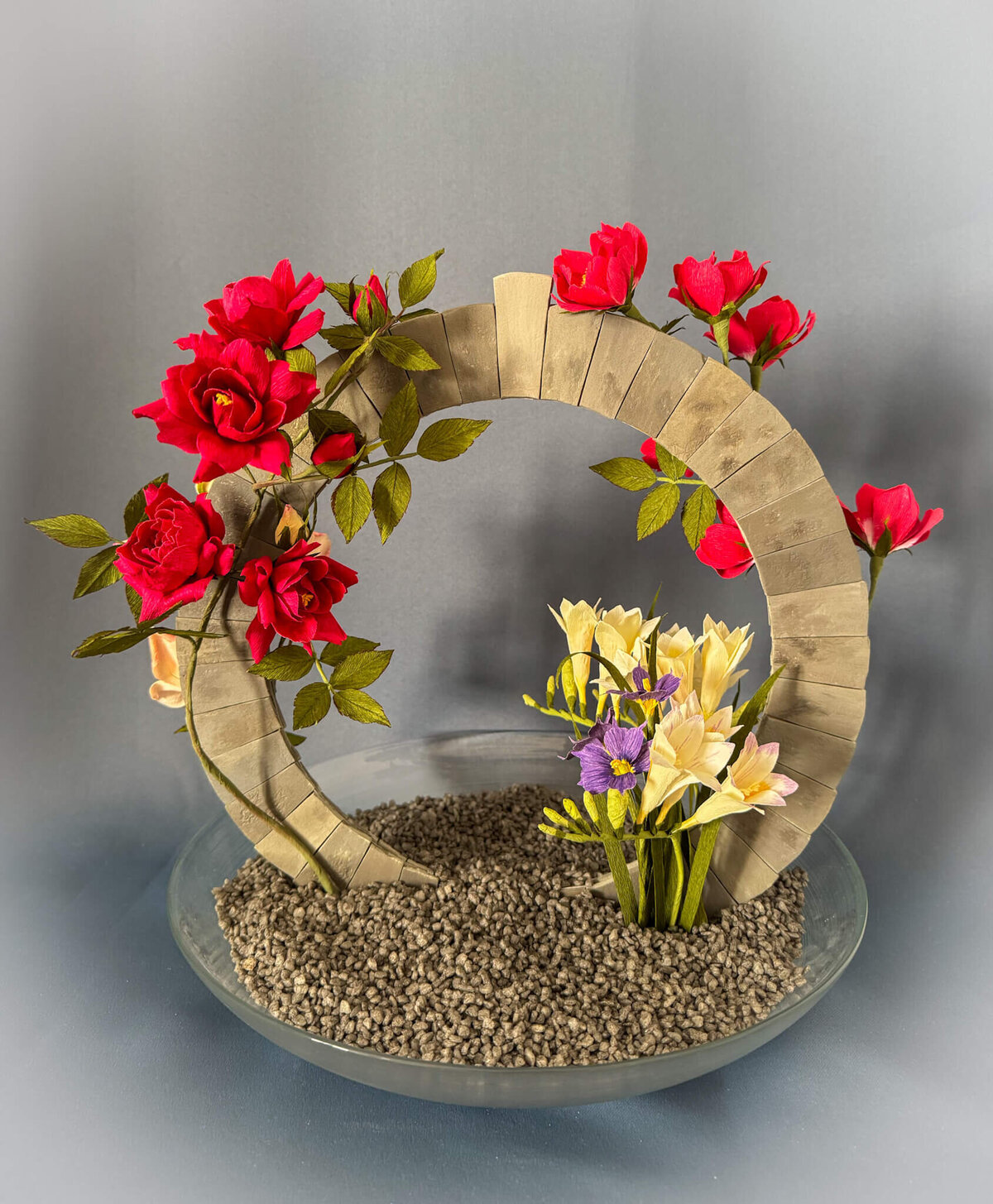 Artwork featuring a moongate and Bermudan flowers