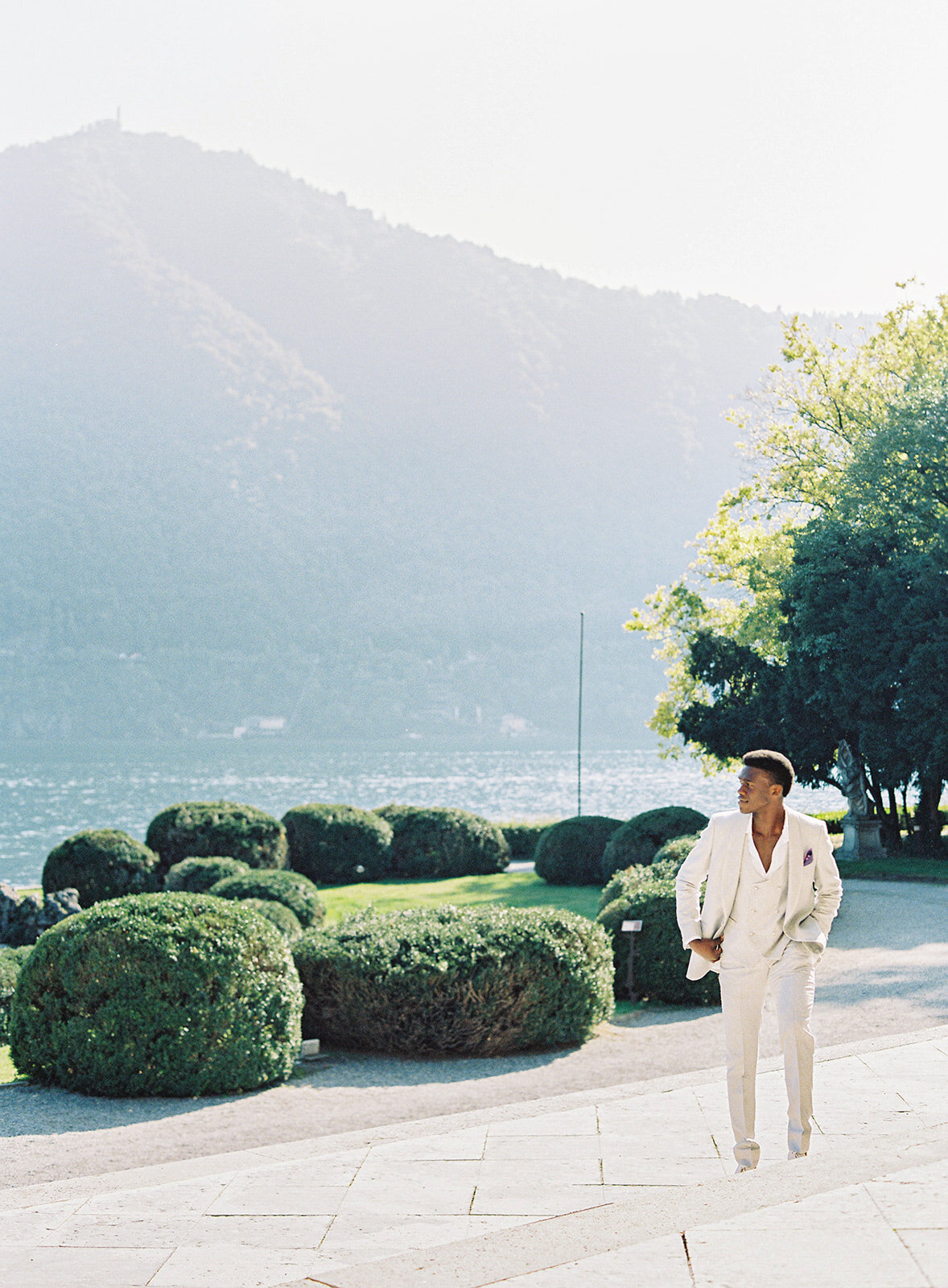 Groom in ivory textured tuxedo at wedding at Villa Erba on Lake Como photographed by Italy Wedding photographer
