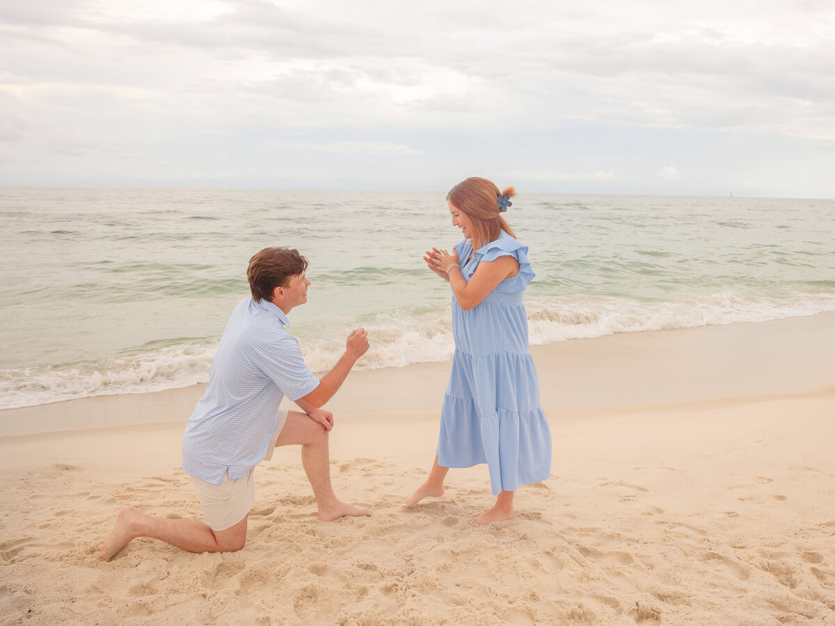 Sweet moment for proposal beachfront