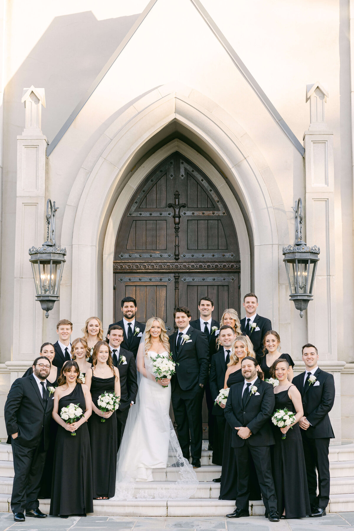 wedding party in all black at park chateau