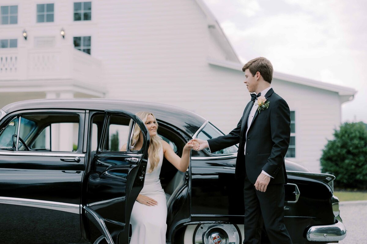 Harvest Hollow Wedding Photo with Bride and Groom in Getaway Car