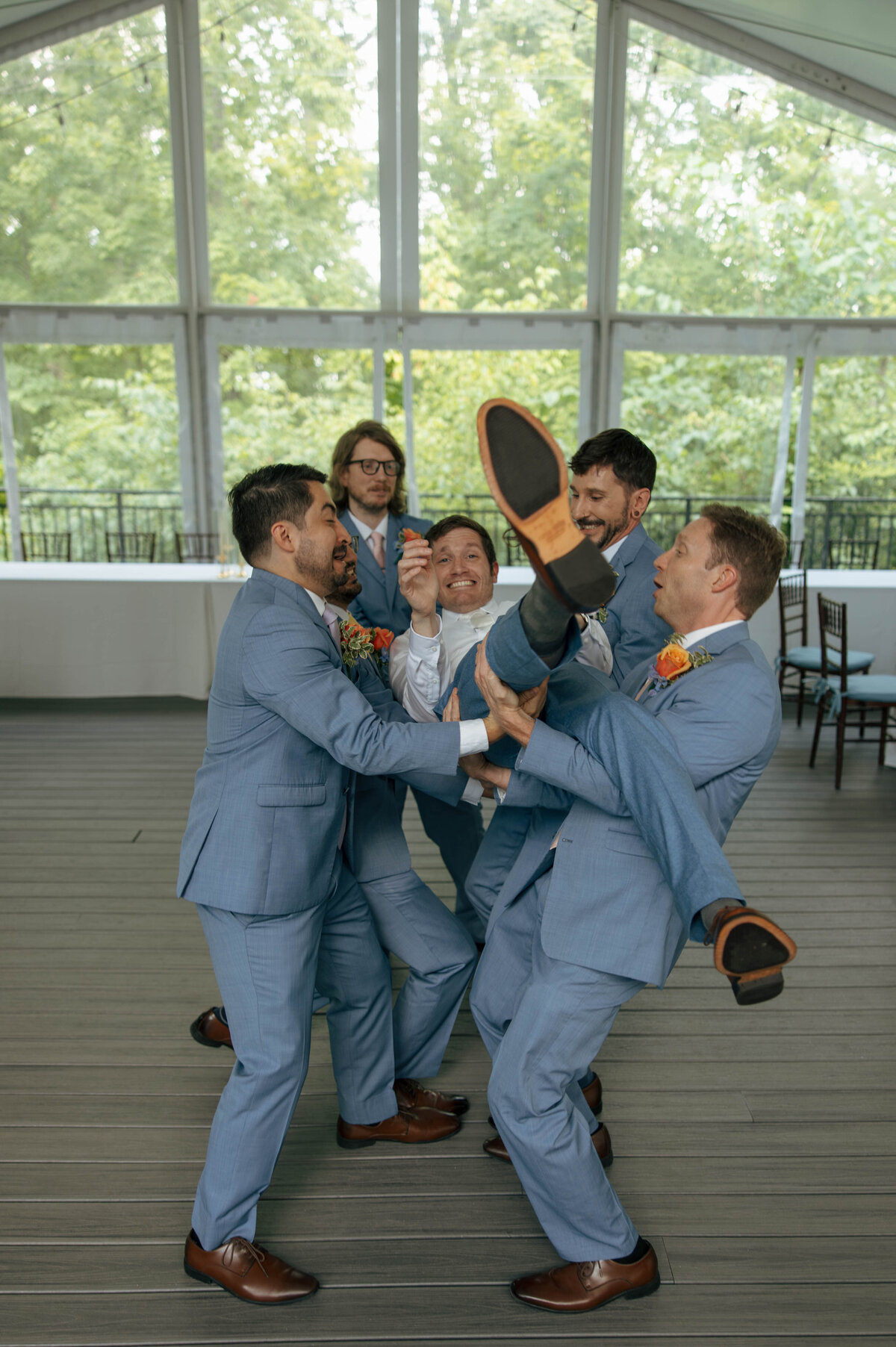 Groom and groomsmen poses at the Groesbeck Estate in Milford, Ohio