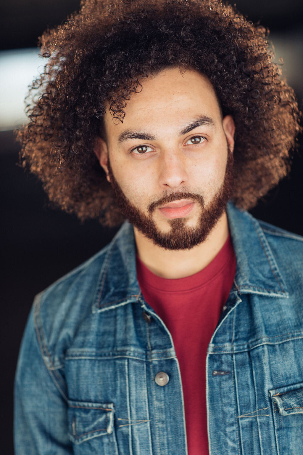 Young Man Wearing Denim Outer Coat with Inner Maroon Shirt Headshot in LA