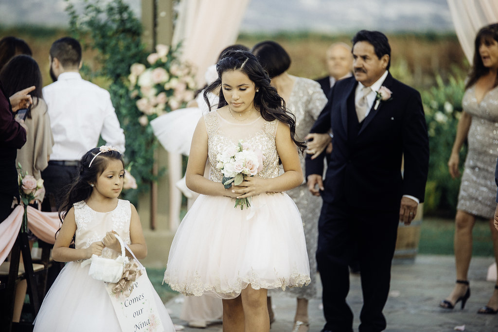 Wedding Photograph Of Lady And Flower Girl Walking Los Angeles