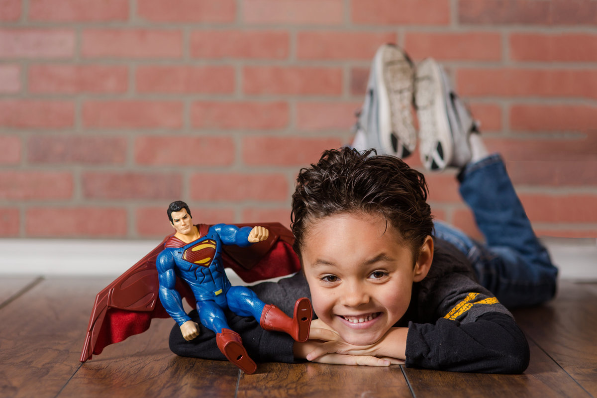 kid with toy superman