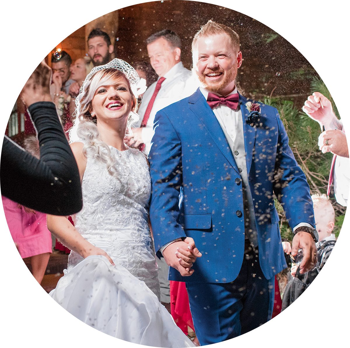 bride and groom laughing during bubble sendoff at Log Haven