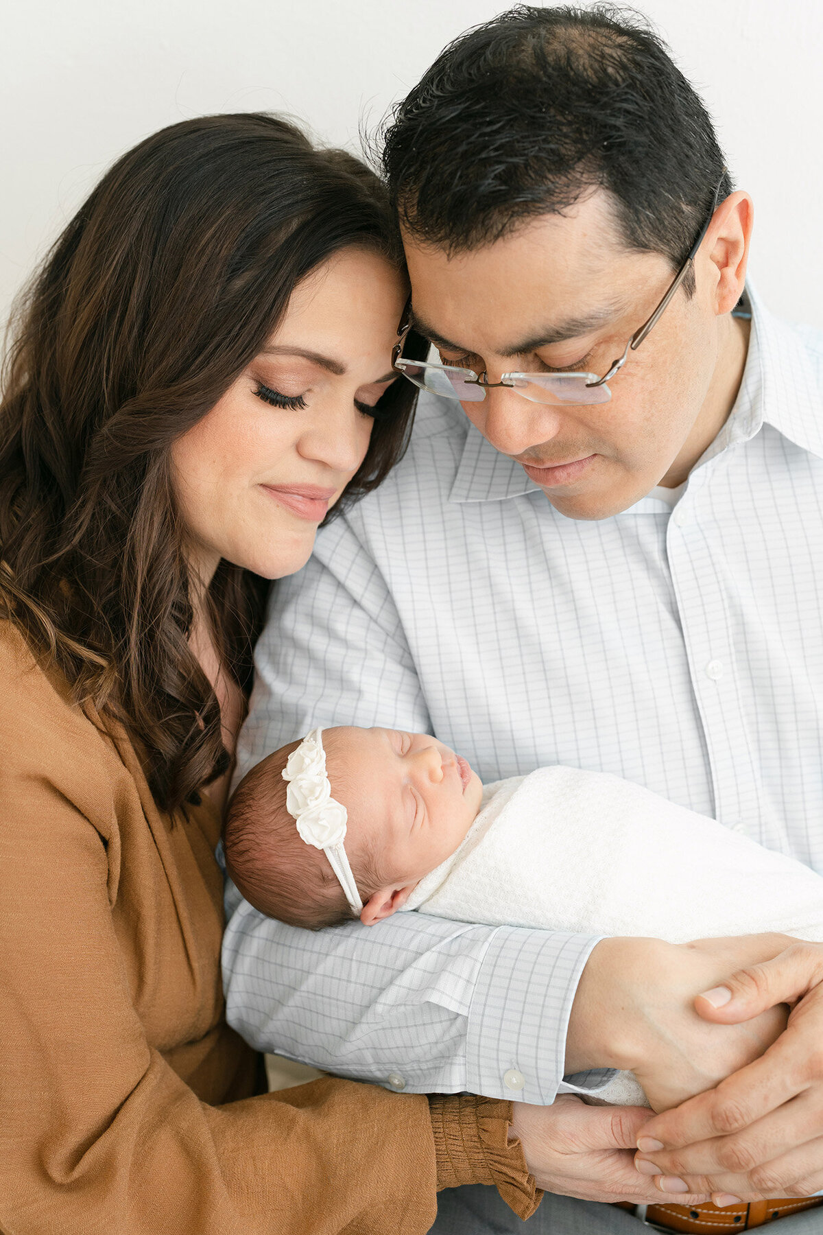 Louisville Ky couple hold baby with newborn photographer Julie Brock