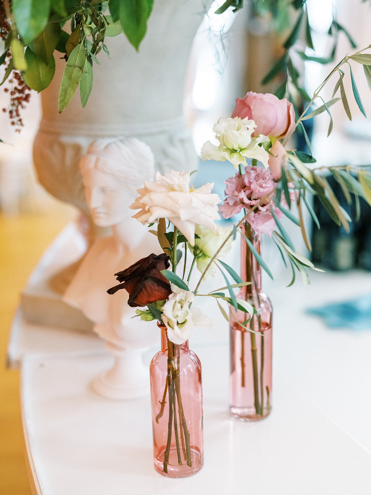 This romantic summer solstice wedding held at the elegant War Memorial was filled with pops of cherry red, pink and white flowers and lush greenery. Floral Design by Rosemary and Finch in Nashville, TN.