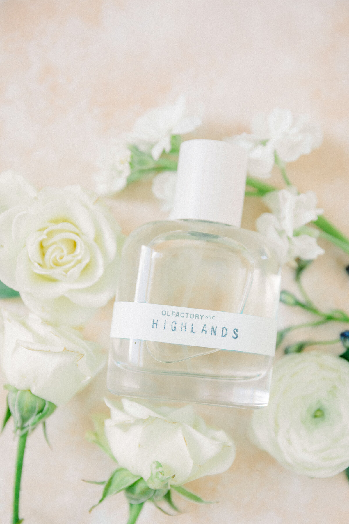 Olfactory NYC Highlands perfume surrounded by beautiful white florals