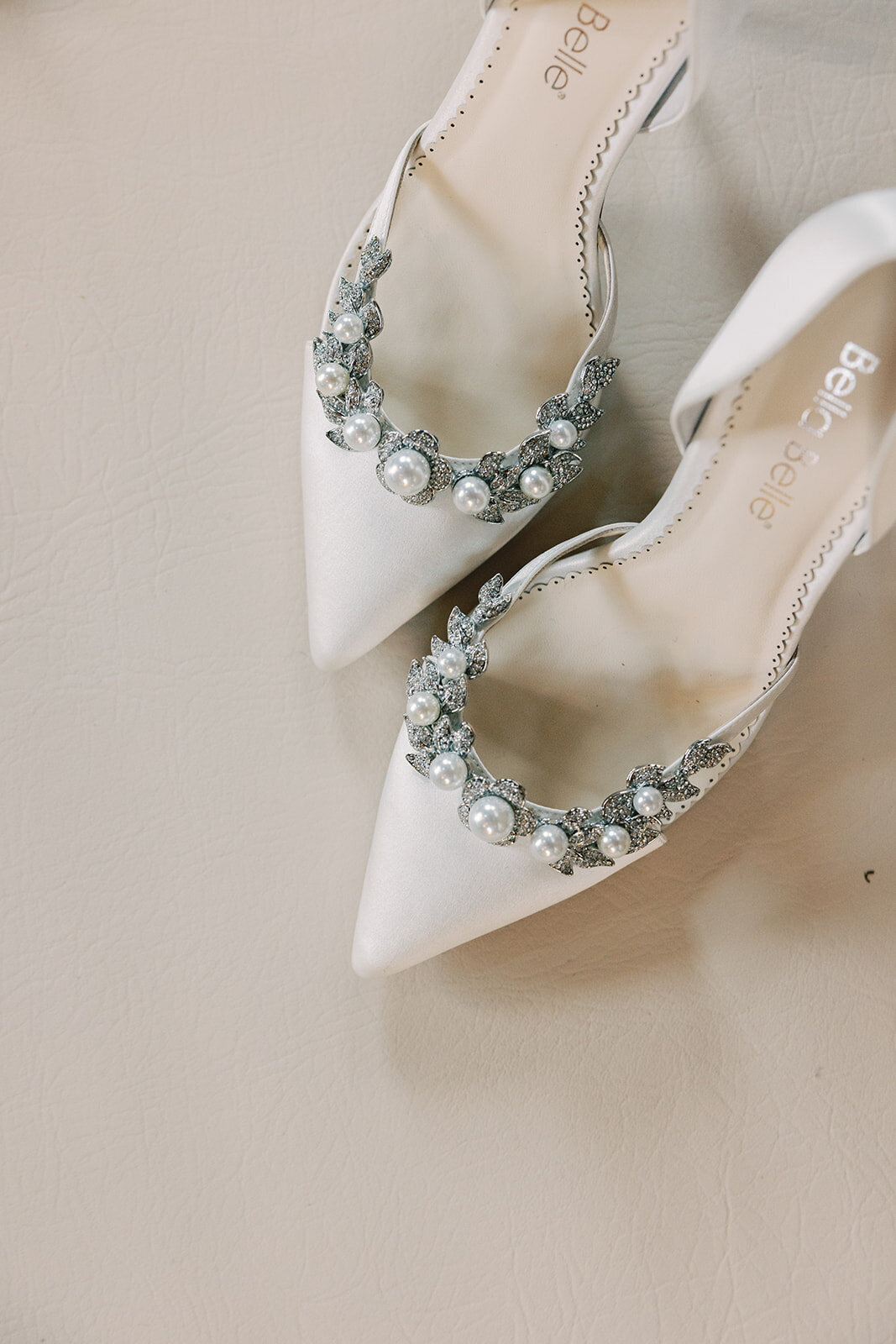 White pointed heels with pearls and rhinestones