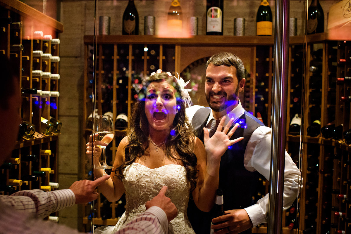 A bride and groom are caught in the wine cellar at Union Trust Wedding.
