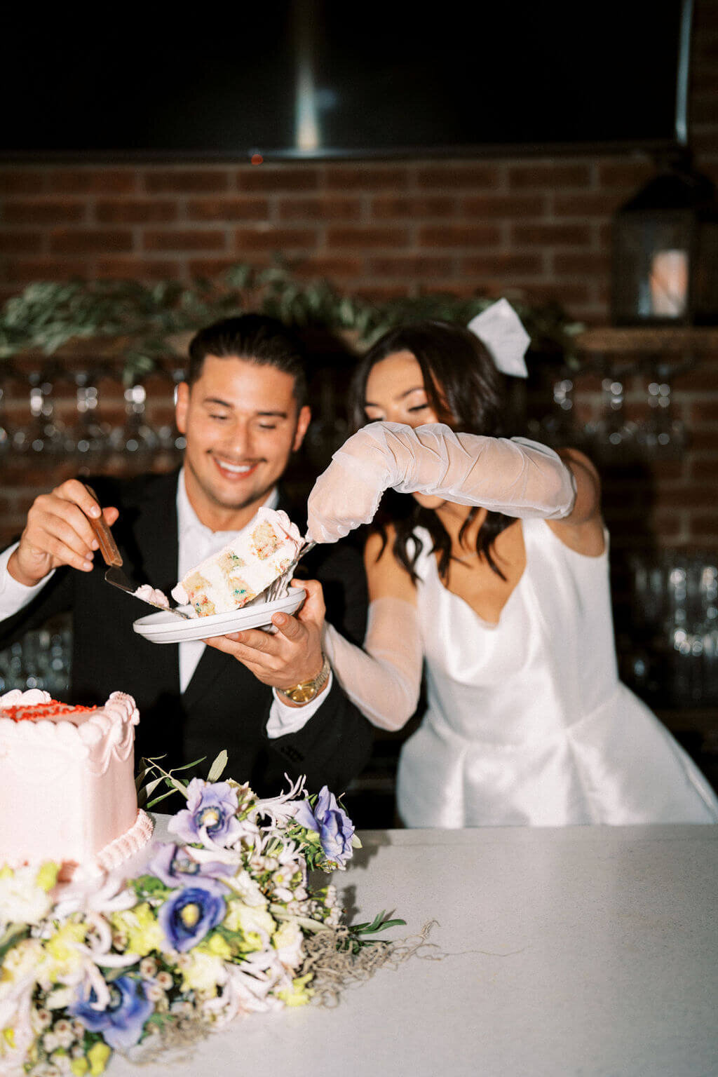 Couple eating their wedding cake at their elopement