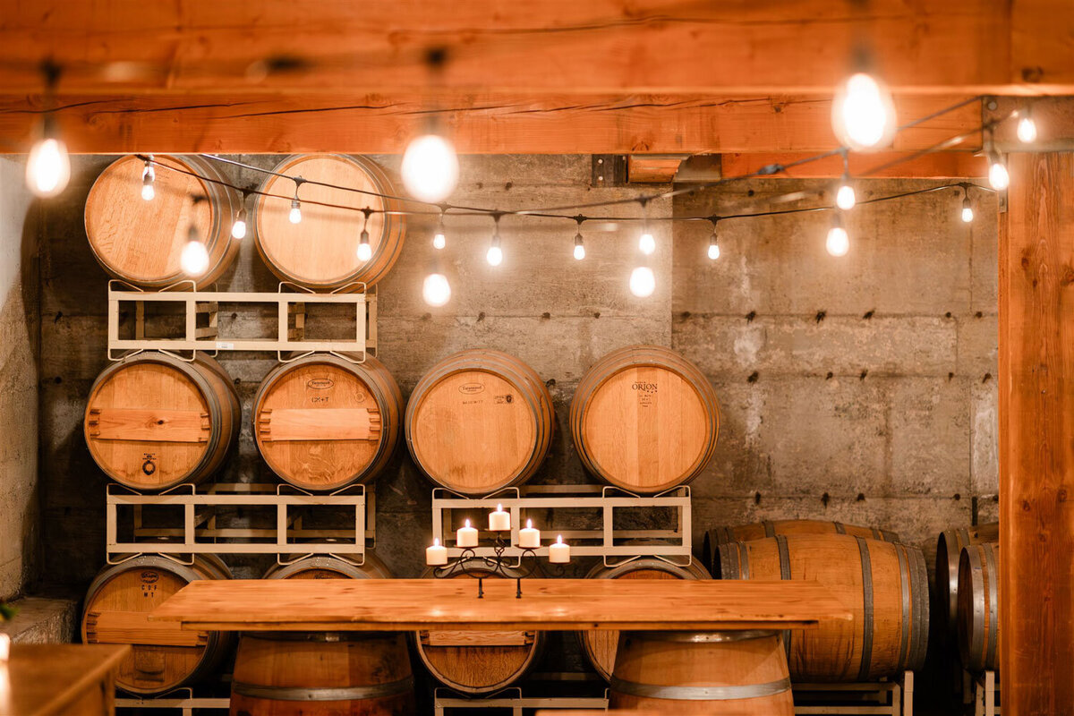 The Barrel room at Chateau Lill full of wine barrels
