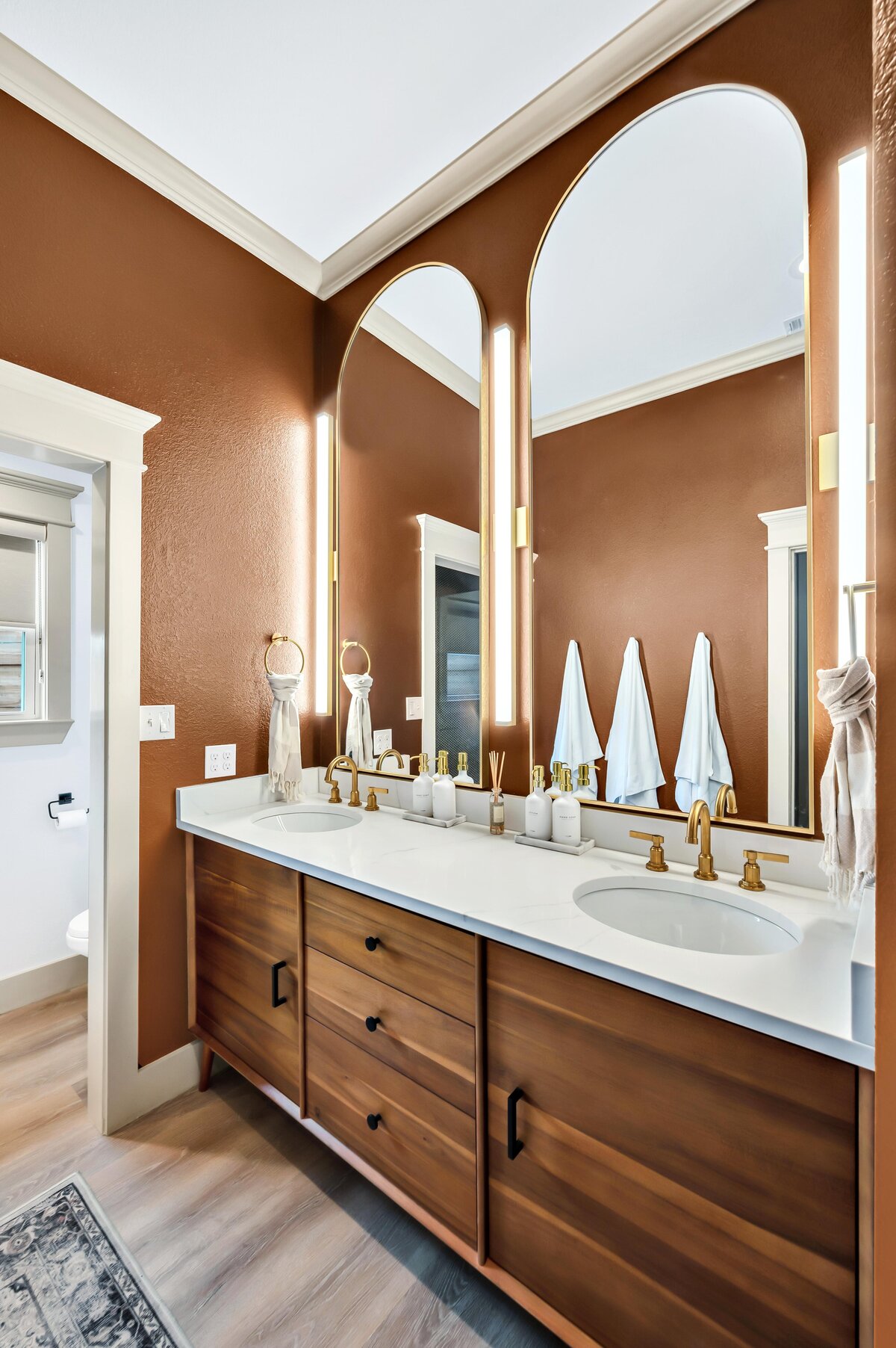 Luxurious double vanity in the bathroom of this three-bedroom, three-bathroom vacation rental home with free wifi, outdoor theater, hot tub, propane grill and private yard in Waco, TX.