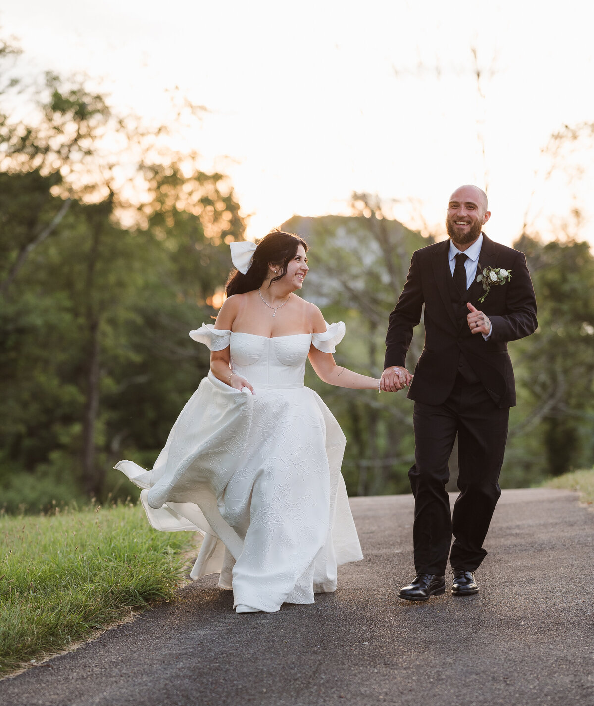 candid golden hour bride and groom photo running