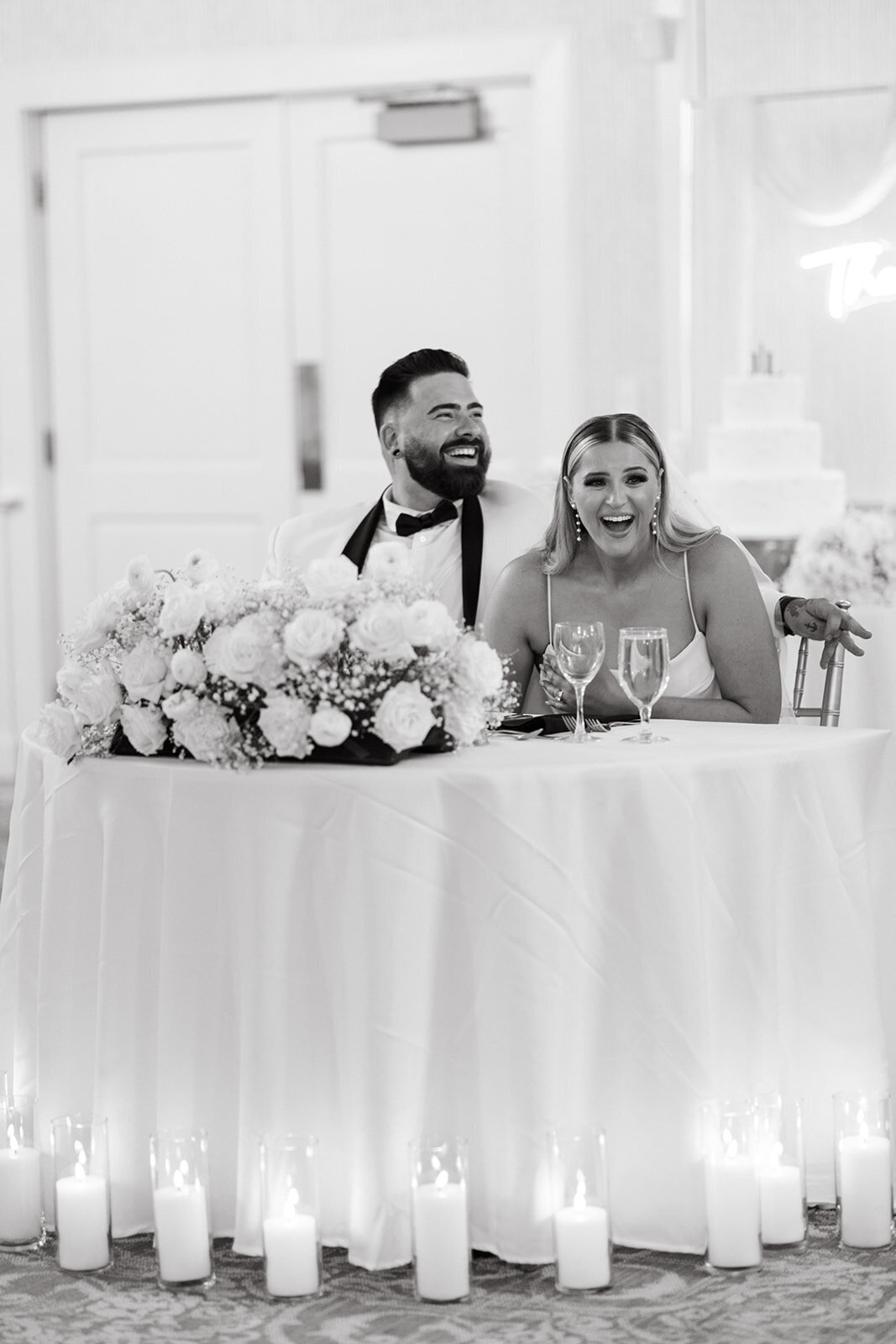 bride-and-groom-at-sweetheart-table-during-speeches-saint-clements-castle