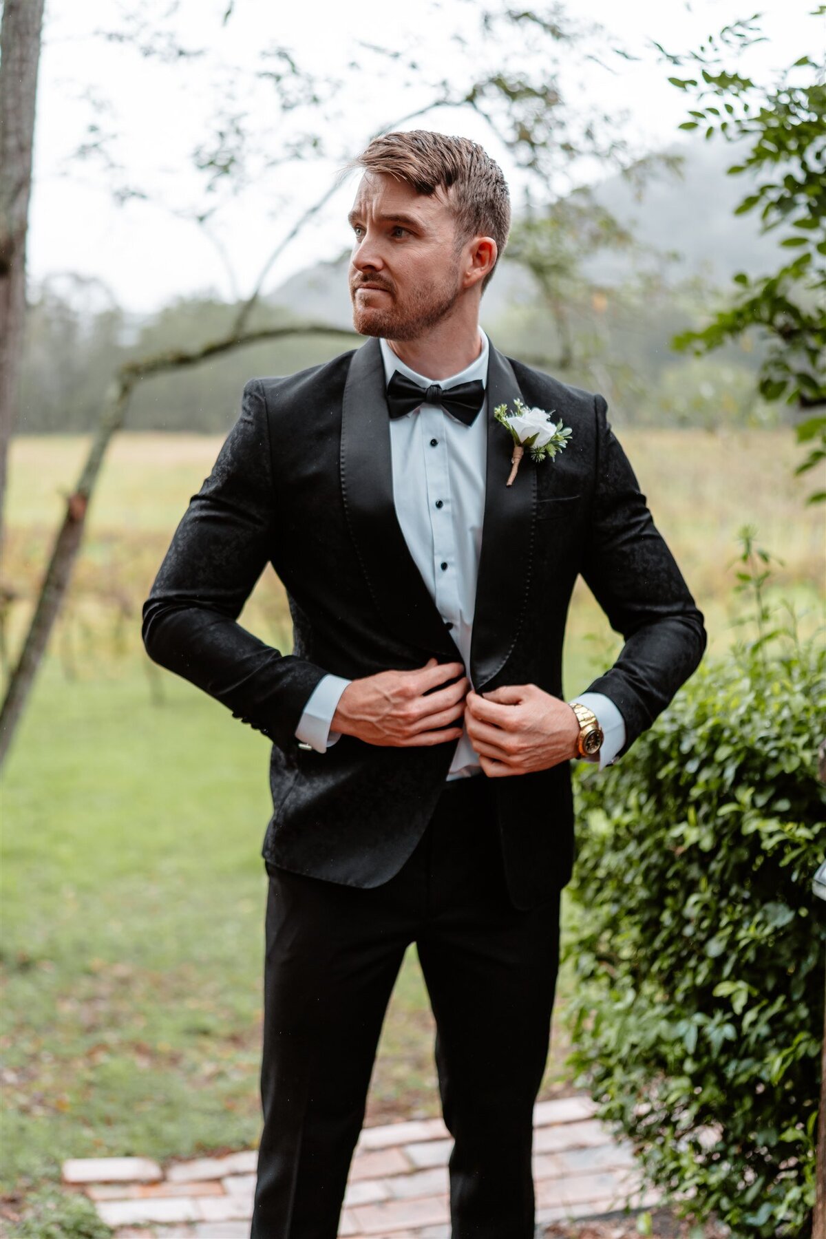 Captivating and charismatic groom, a beacon of charm and sophistication, ready to sweep his bride off her feet on their special day.