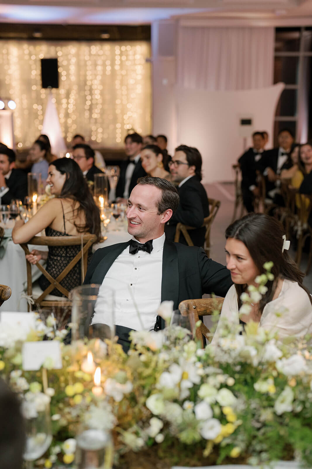 Wedding guests watch as Maid of Honor gives a toast at Aspen Meadows Resort in Aspen, Co.