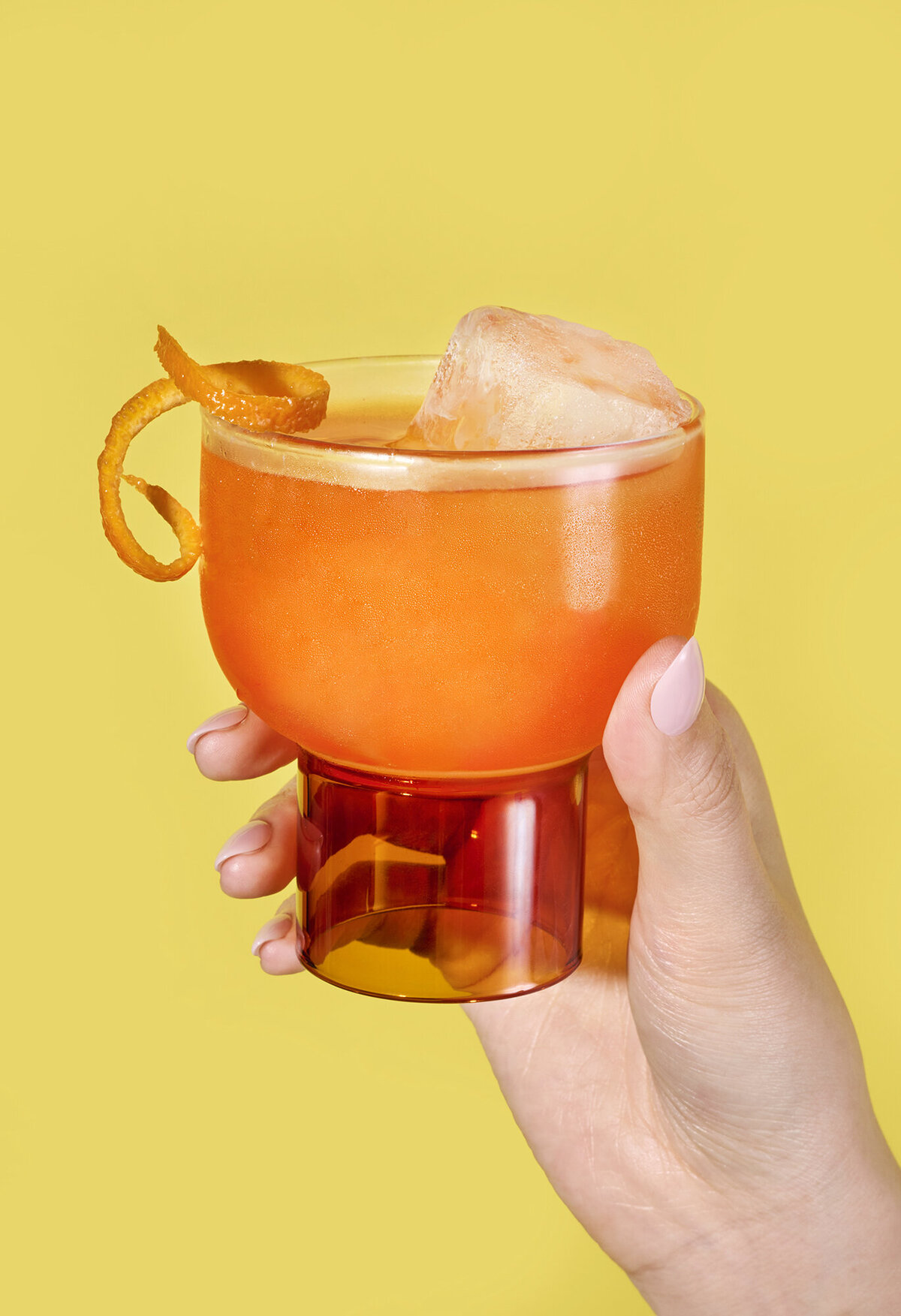 beverage photography with hand model holding aperol spritz