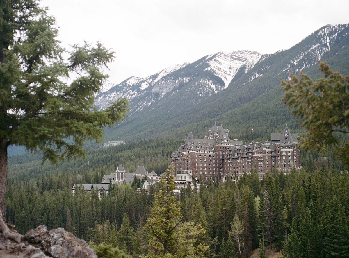 Fairmont Banff Springs hotel with Rocky Mountains in the background