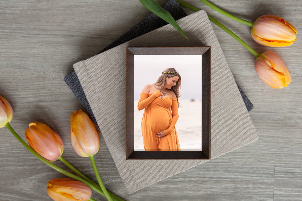 framed photo of a pregnant Woman in an orange dress