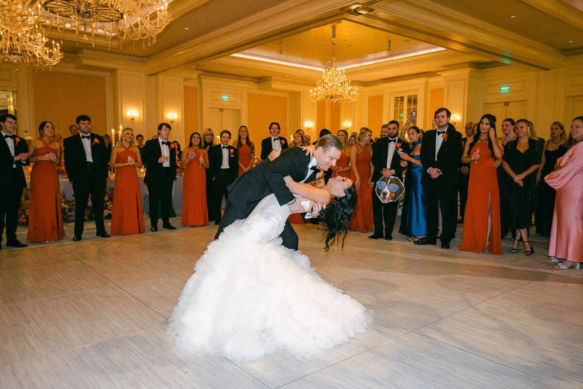 groom dips bride on the dancefloor at St. Regis Atlanta wedding