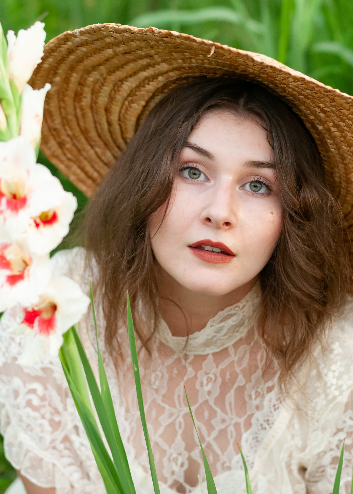 Bowling Green KY Photographer: Portrait of a woman wearing a hat in a field of flowers.