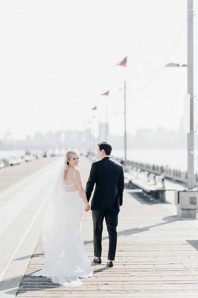couple walking on a pier
