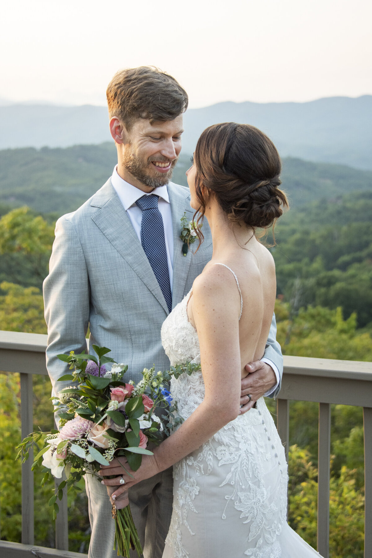 Couple smiling during mountain top wedding at Hawkesdene