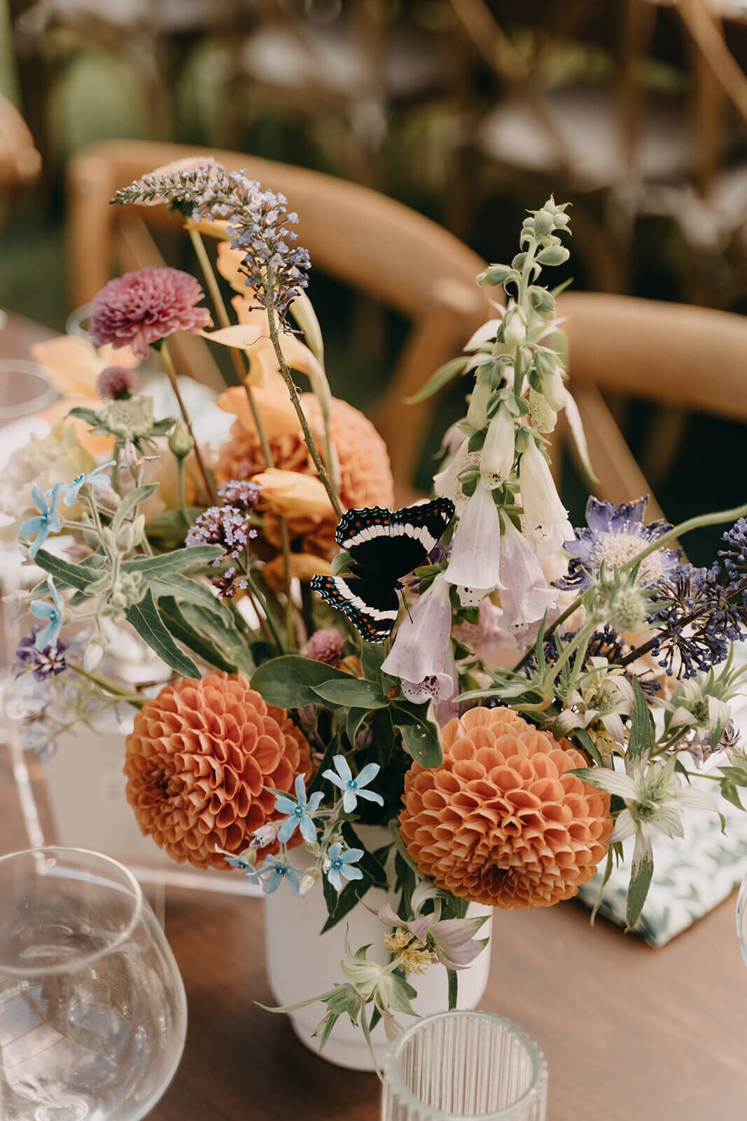 56.vibrant-floral-wedding-centerpiece-orange-purple-green-butterfly.