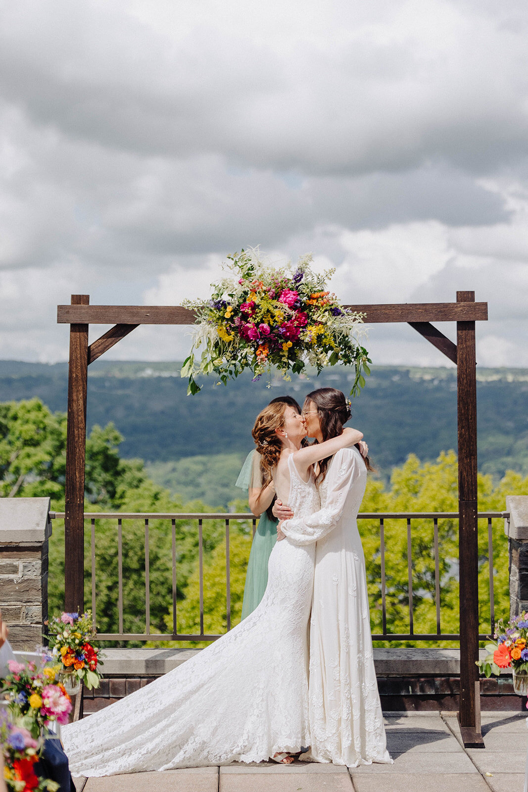 Brides kissing after wedding ceremony at Cornell University