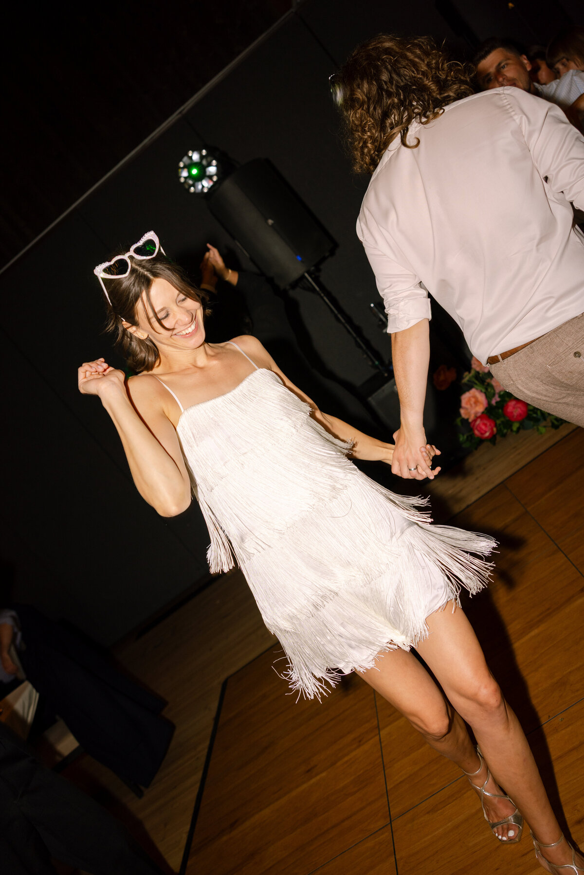 Oregon bride in a dance floor party dress featuring flash photography representing full service calligraphy and design by Life in Letters
