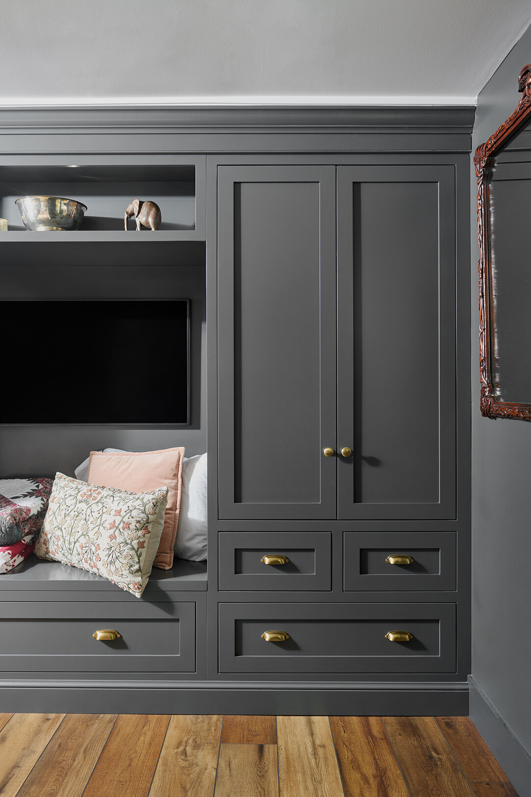 dark gray built-in cabinet with televsion