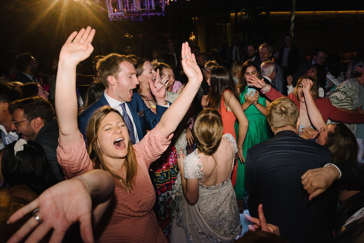 Big group of friends dancing like wild