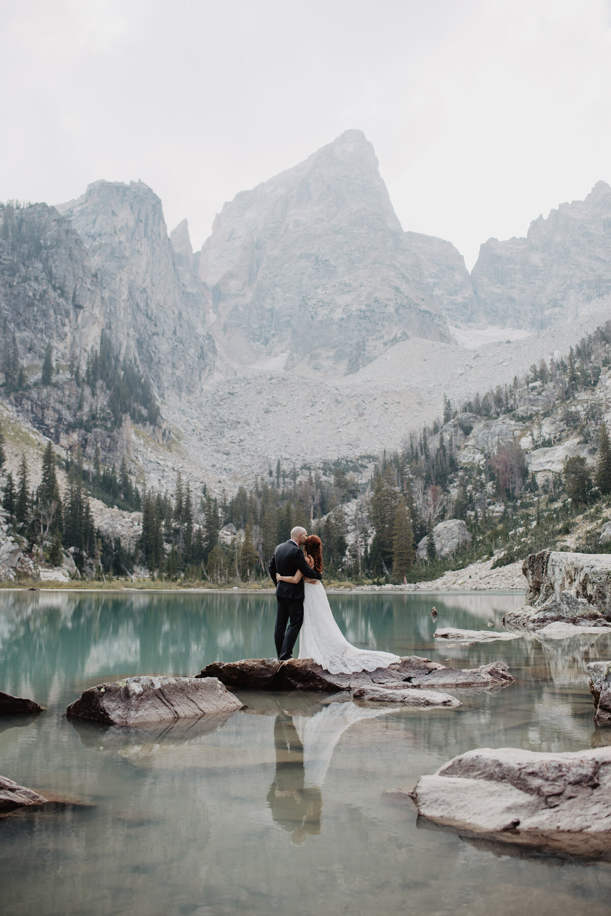 Jackson Hole Photographers capture couple hugging in Grand Teton elopement
